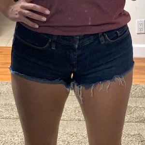 Dark blue denim, stretchy cut off jean shorts size 27
